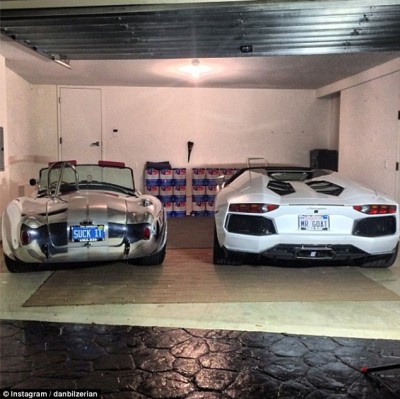 His expensive vehicles, pictured, are adorned with personalized plates that read 'SUCK IT' and 'MR GOAT' - his other moniker